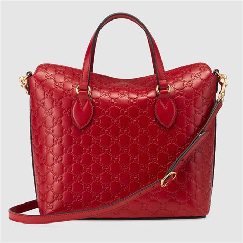 used gucci top handle bags leather